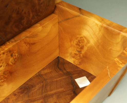 inside, heirloom box with the top open, box is 13″ x 7″ x 4″ materials: unknown burl, blistered big leaf maple